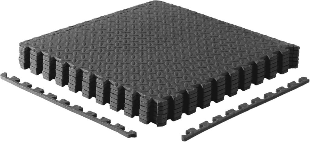 Stack of black EVA puzzle mats with interlocking edge strips
